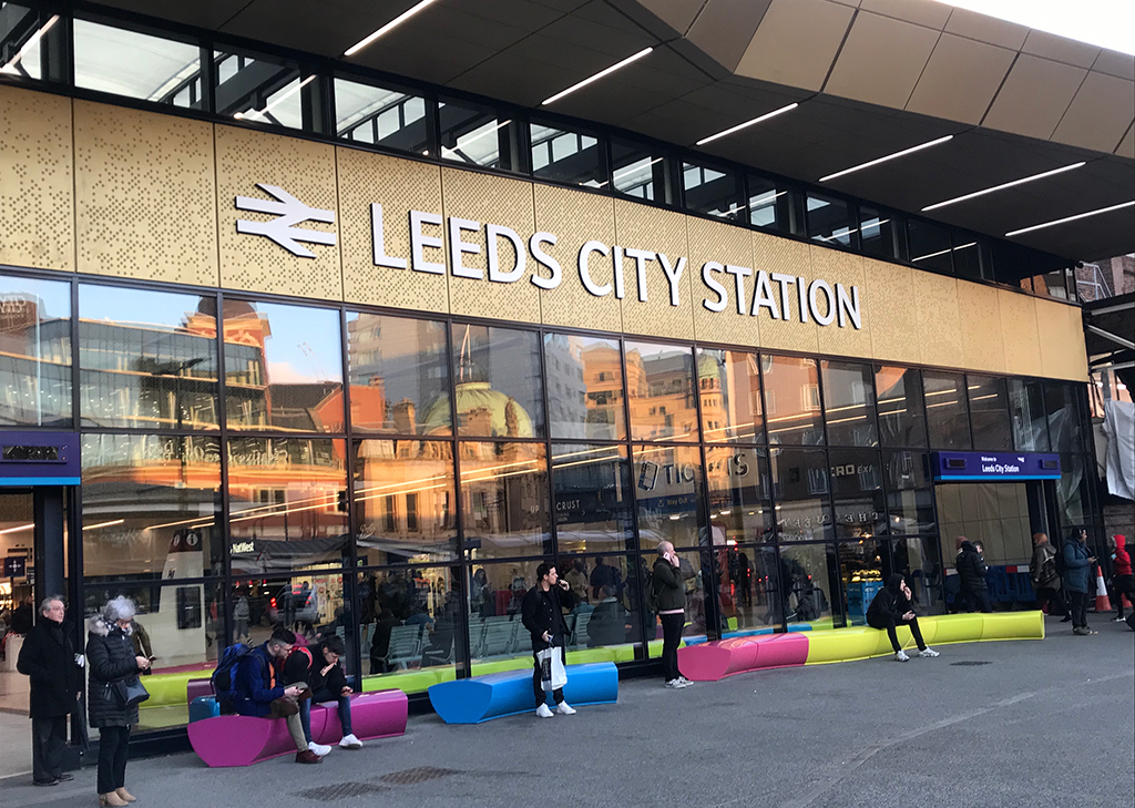 Outside Leeds City Station facing new gold entrance.